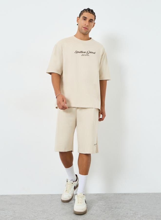 Styli Men Beige Graphic Oversized T-Shirt and Shorts Co-Ords - Image 1